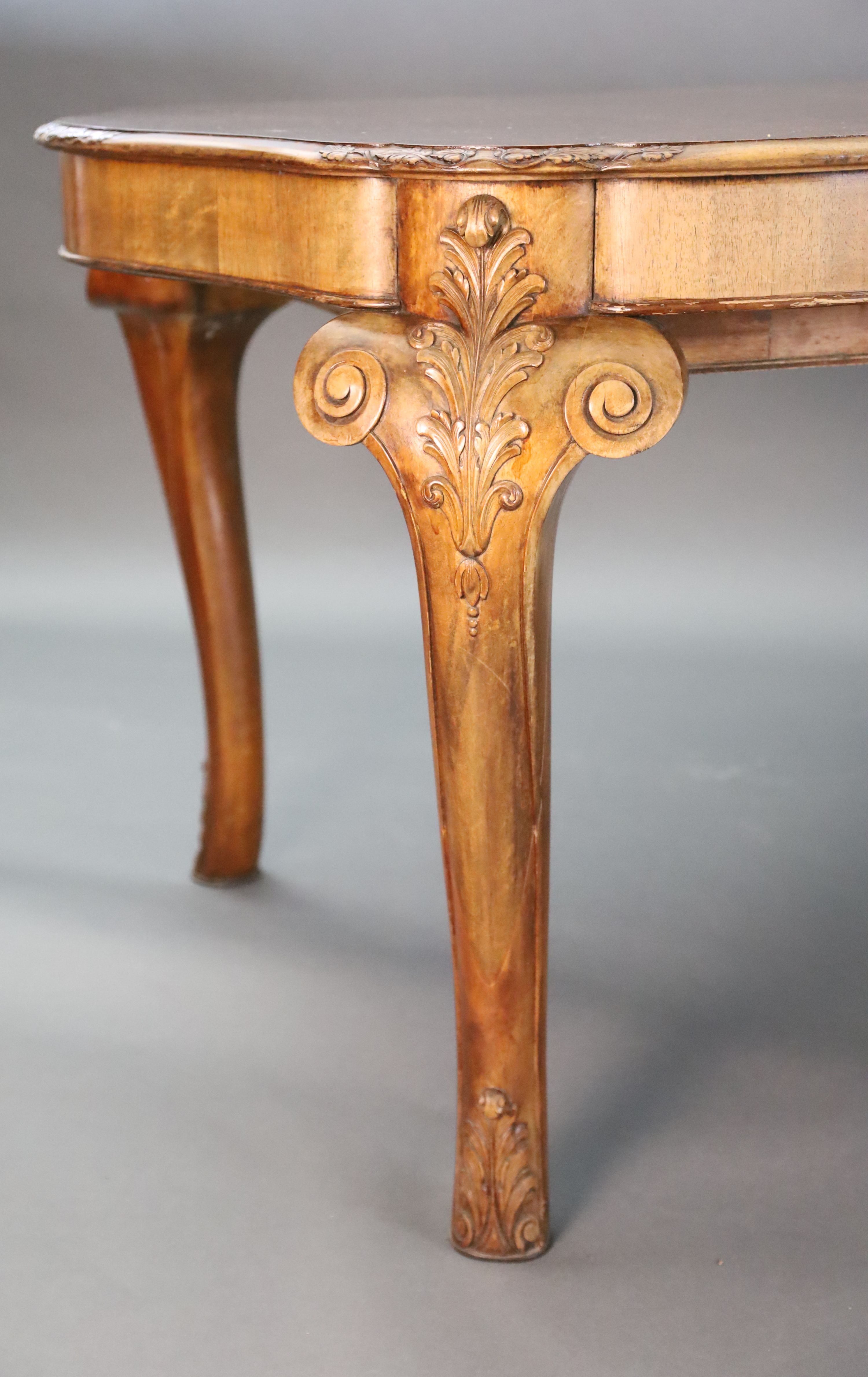 A Queen Anne style burr walnut extending dining table, W.3ft 5in. L.6ft 10in. extends to 8ft 10in. H.2ft 6in.